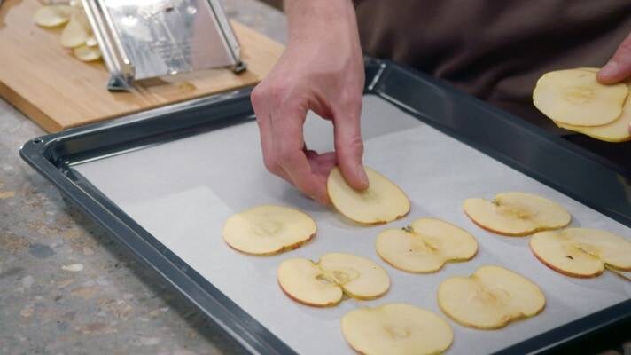 Apple slices on baking paper