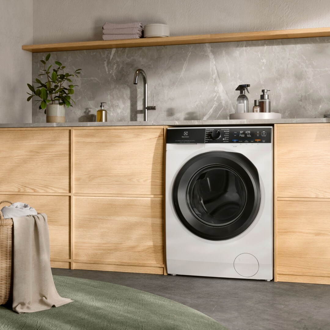 Washer dryer placed in a laundry room. 