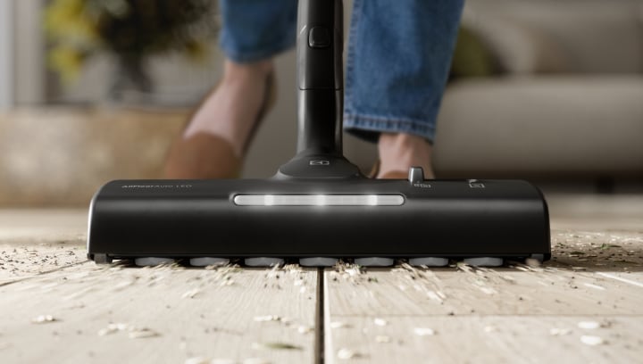 Vacuum nozzle cleaning dirty floor.