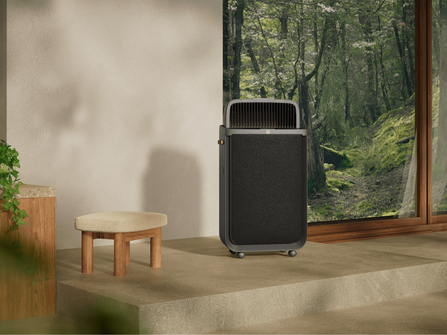 Air purifier on floor next to a window