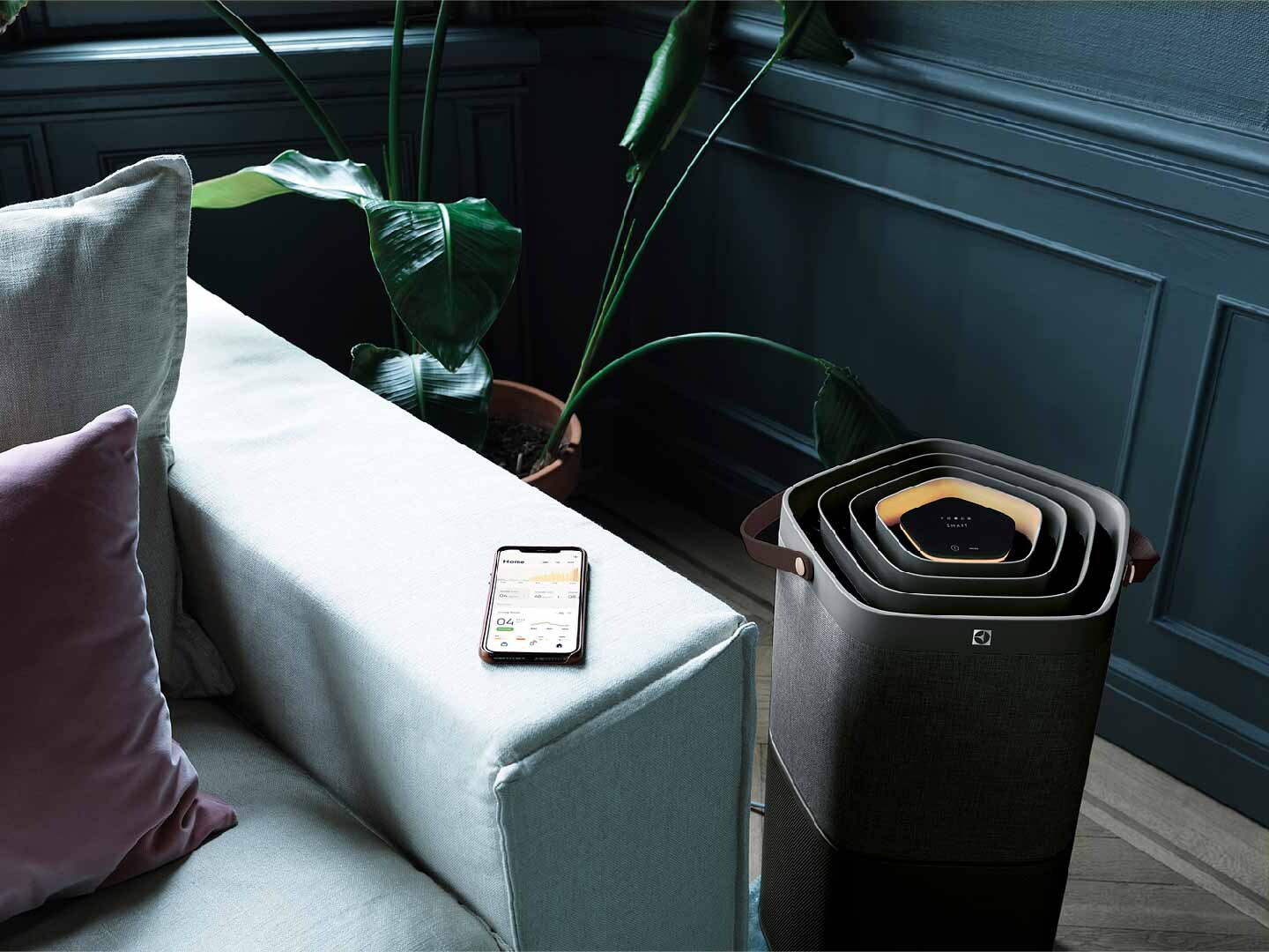 AirCare besides sofa and phone